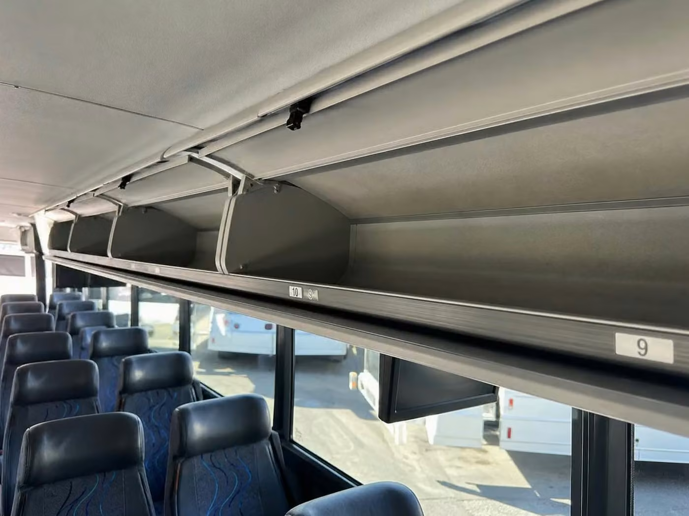 bell 25 passenger minibus overhead storage