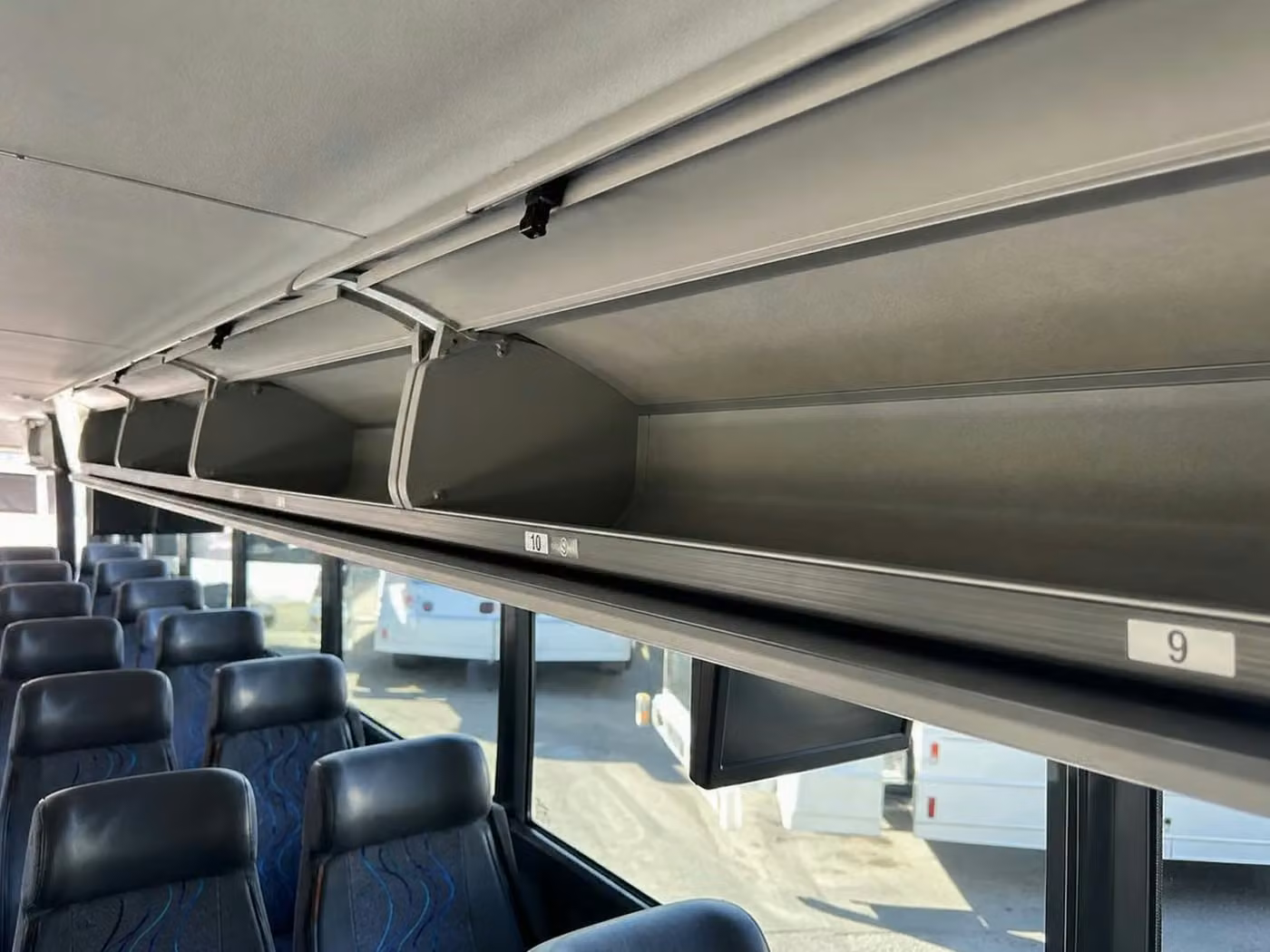 bell charter bus overhead storage